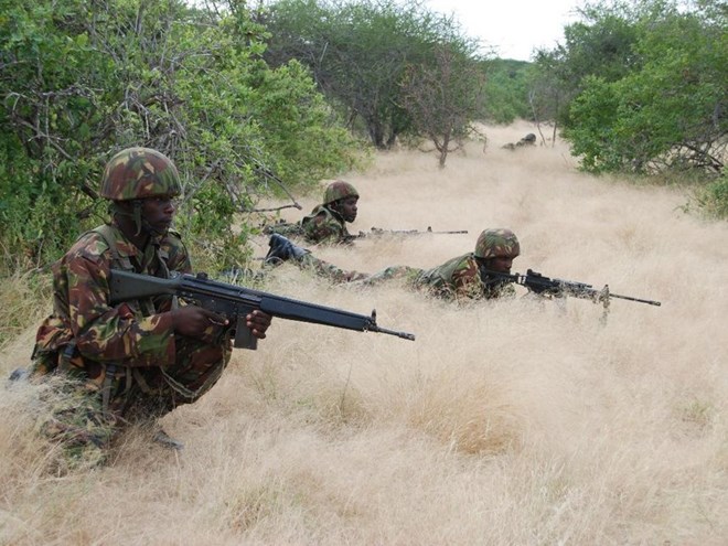 A file photo of KDF soldiers taking cover during an operation in Somalia. /FILE